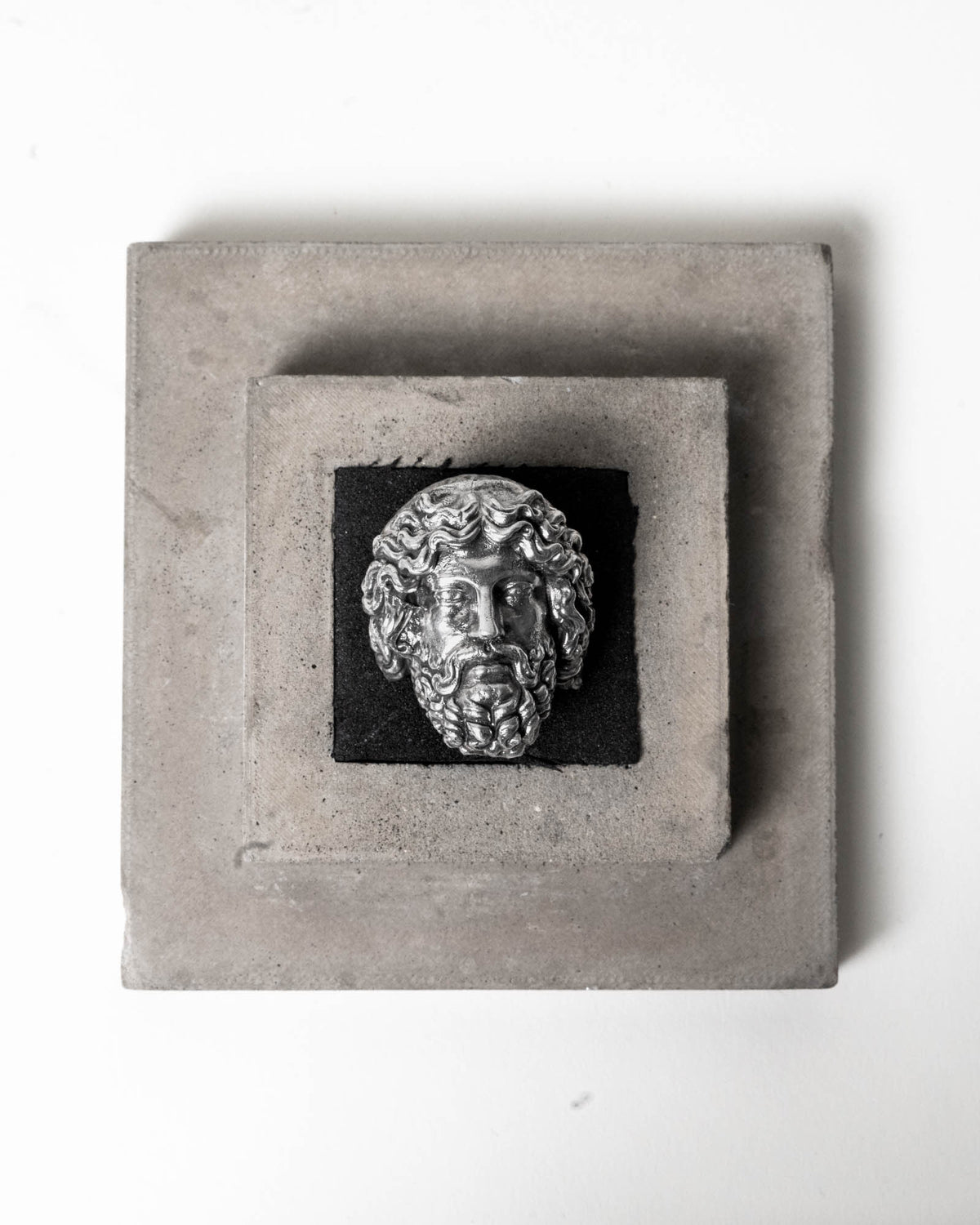 Zeus Ring Sterling Silver on top of package