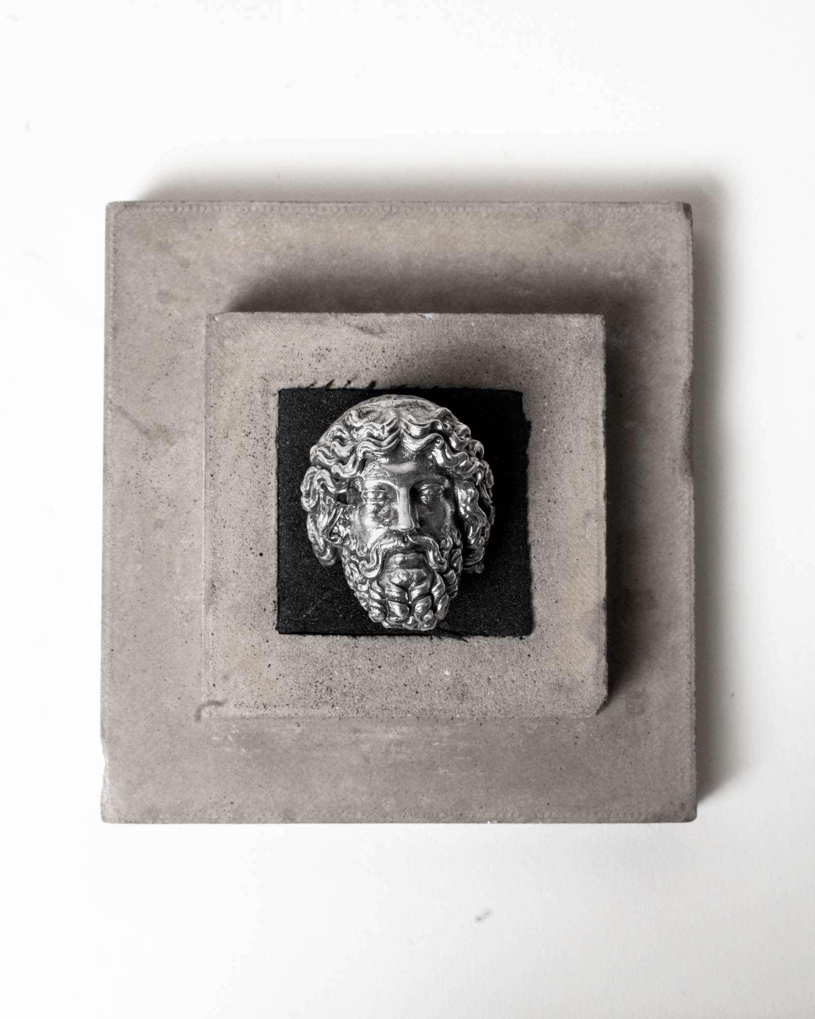 Zeus Ring Sterling Silver on top of package